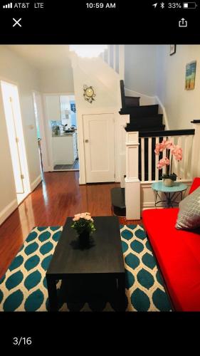 a living room with a coffee table and a piano at Best Bedroom Next to JHU in Baltimore