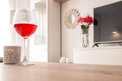 a glass of red wine sitting on a table at Chez Vous in Lorca