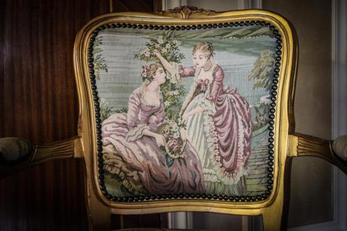 a tapestry hanging on a wall with two women at Quinta Ugarte in Ciudad Lujan de Cuyo
