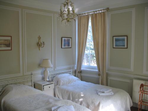 מיטה או מיטות בחדר ב-Rothmans B&B