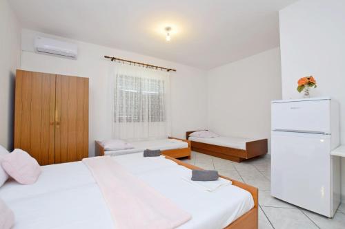 Katil atau katil-katil dalam bilik di Apartment and Rooms Mila