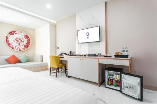 Postel nebo postele na pokoji v ubytování The 8 Hotel Udonthani