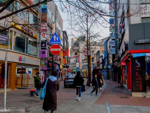 a group of people walking down a busy city street at Toyoko Inn Daegu Dongseongro in Daegu