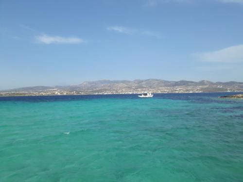 a boat in the middle of the ocean at Aliki Panorama Rooms -breakfast included- in Aliki