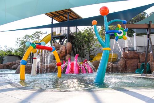 a water park with many different colored fountains at OZO Phuket in Kata Beach