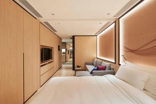 Voodi või voodid majutusasutuse CM+ Hotels and Serviced Apartments toas