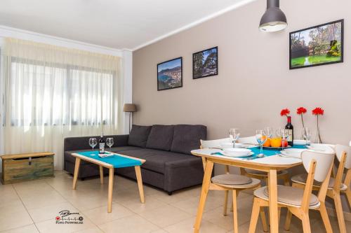 a living room with a couch and a table at Apartament Solar in Alicante