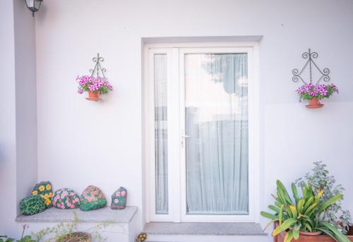 a front door with easter eggs on a porch at B&B Nell'Isola in Carloforte