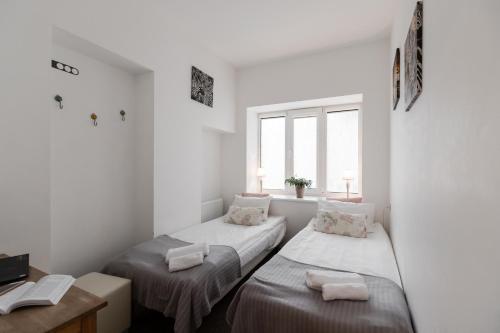 Postel nebo postele na pokoji v ubytování Happy Inn