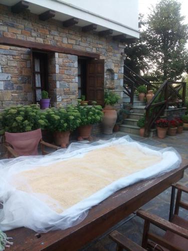 a large mattress sitting on top of a wooden table at Dimosthenis Karastamatis Rooms in Xorychti