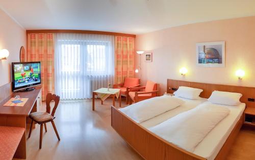 Postel nebo postele na pokoji v ubytování Kurhotel Anders