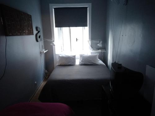 Cama o camas de una habitación en Edith Cavell10 Lisbon Guest House
