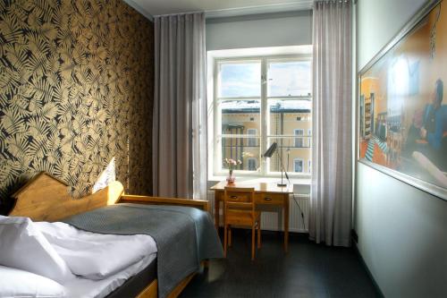 Postel nebo postele na pokoji v ubytování Hotel Lasaretti