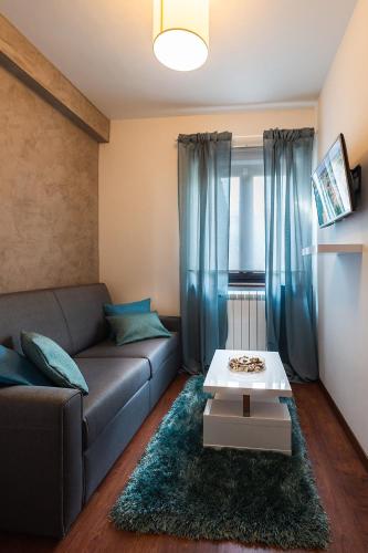 a living room with a couch and a table at Apartment Auretta in Novigrad Istria