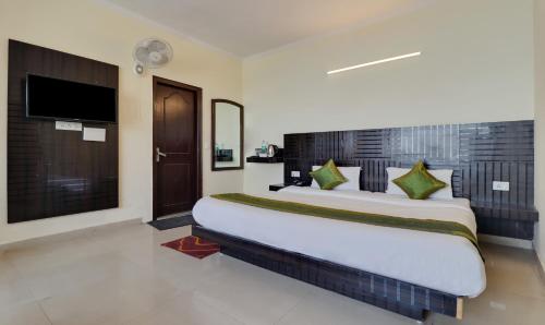 Cama o camas de una habitación en Treebo Mayur, Mall Road