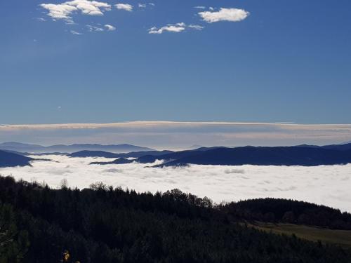a view from the top of a mountain with clouds at Casa Jole in Poppi