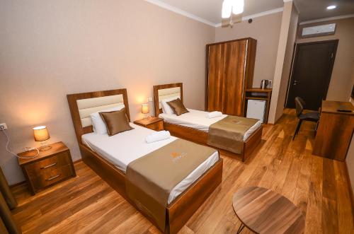 Кровать или кровати в номере Hotel Absolut