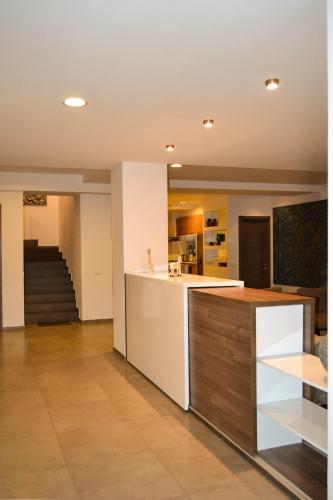 an open kitchen and living room with a counter at Tbilisi View Hotel in Tbilisi City
