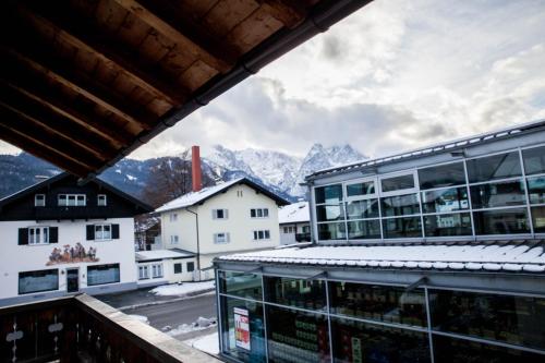 a view from the balcony of a building with mountains at Ferienhaus Butterfly in Garmisch-Partenkirchen