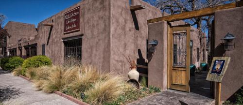 a building with a door and a sign on it at Abiquiu Inn in Abiquiu