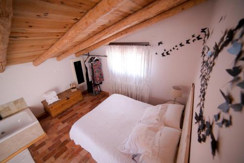 Una cama o camas en una habitación de El Zaguán