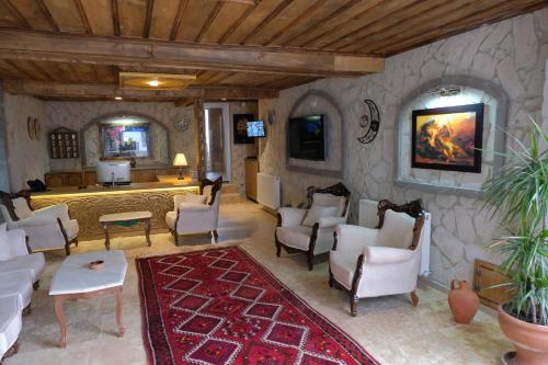 a living room filled with furniture and a fireplace at Grand Elite Cave Suites in Goreme