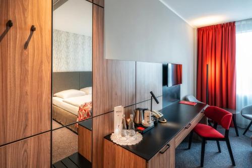 Postel nebo postele na pokoji v ubytování HP Park Plaza