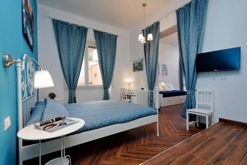 En eller flere senge i et værelse på Domus Ponte Milvio