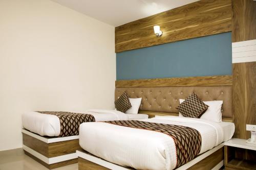 Letto o letti in una camera di Ganges Grand