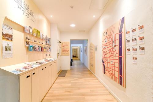 a corridor in a building with a hallway at SLO Hostel Lyon les Pentes in Lyon