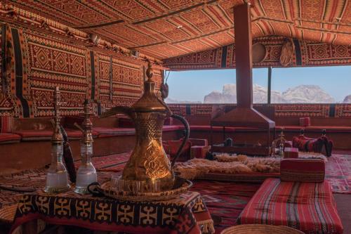 a large vase sitting on a table in a room at Arabian Nights in Wadi Rum