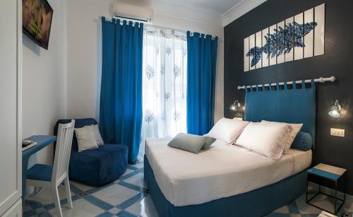 Postel nebo postele na pokoji v ubytování B&B Amalfè