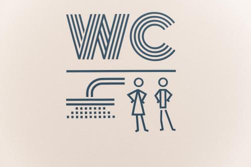 two people standing in front of awwc logo at SLO Hostel Lyon Saxe in Lyon