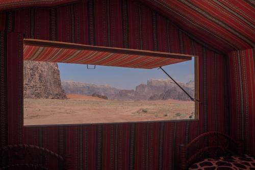 a window in a room with a view of the desert at Arabian Nights in Wadi Rum
