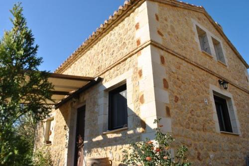 a brick building with windows on the side of it at 5 Stars Villas in Svoronata