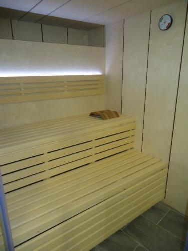 a sauna with a clock on the wall at Hotel Ridomar 365 in Lloret de Mar