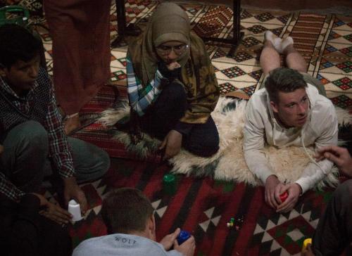 a group of people sitting on the floor at Arabian Nights in Wadi Rum