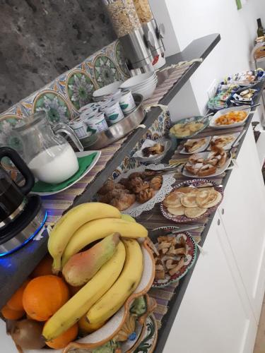 a bunch of bananas and other foods on a counter at Villa Manning Relais in Sorrento