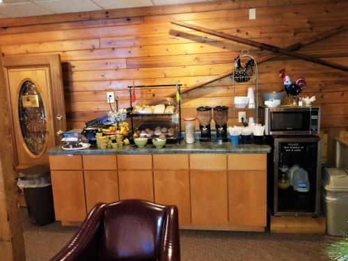 a kitchen with a counter in a wooden wall at St. Croix Inn in Solon Springs