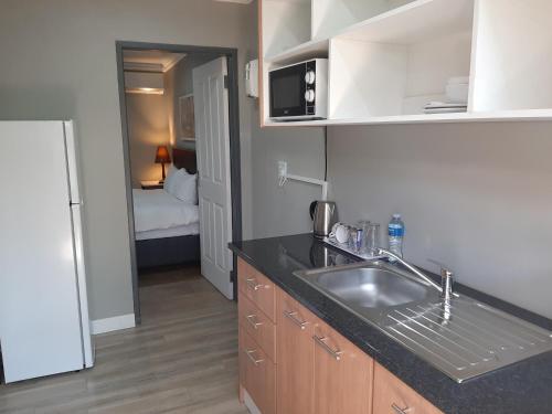 Kuchyň nebo kuchyňský kout v ubytování Lux Rooms on 37