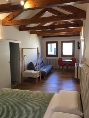 Postel nebo postele na pokoji v ubytování Bianca Cappello House