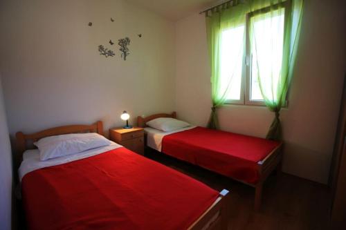 Postel nebo postele na pokoji v ubytování Apartmani Marino