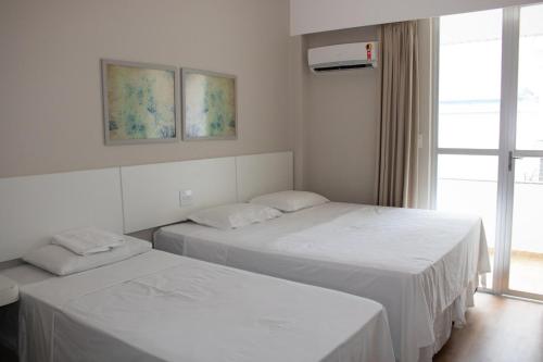 מיטה או מיטות בחדר ב-Antonius Imperial Hotel