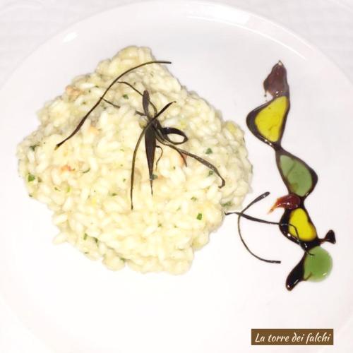 a plate of food with rice on a white plate at Hotel Caserta Antica in Caserta