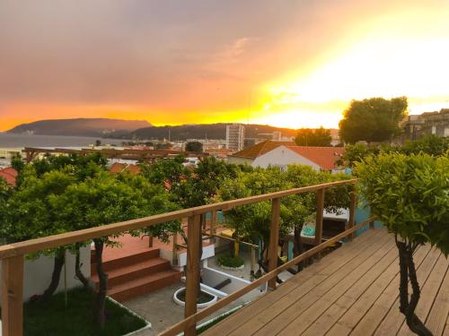 a view from a balcony of a city with a rainbow at Marina Blue - Apartments & Suites in Setúbal