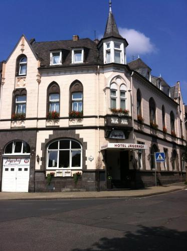 a large building on the corner of a street at Hotel Jägerhof in Mayen