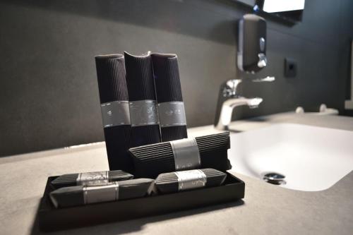 a toothbrush holder on a bathroom counter next to a sink at Residence Al Barcon in Sarcedo