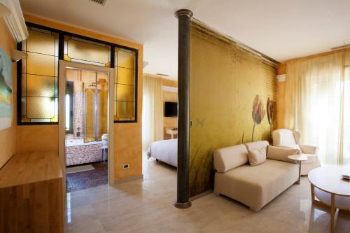Ένα ή περισσότερα κρεβάτια σε δωμάτιο στο Jasmin Charme Hotel