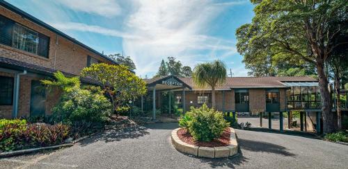 a brick building with a street in front of it at Country 2 Coast Motor Inn Coffs Harbour in Coffs Harbour