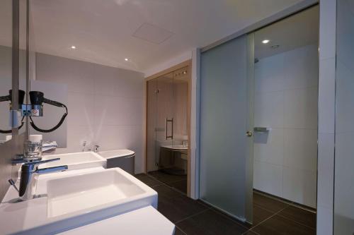Ванная комната в Privathotel alte mühle Wolfsburg-Weyhausen